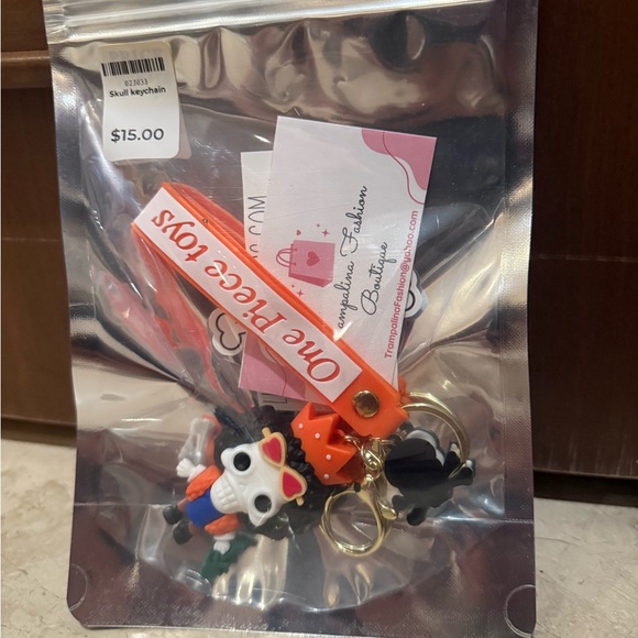 Skull Keychain with Orange and Blue Accents - Picture 4 of 5